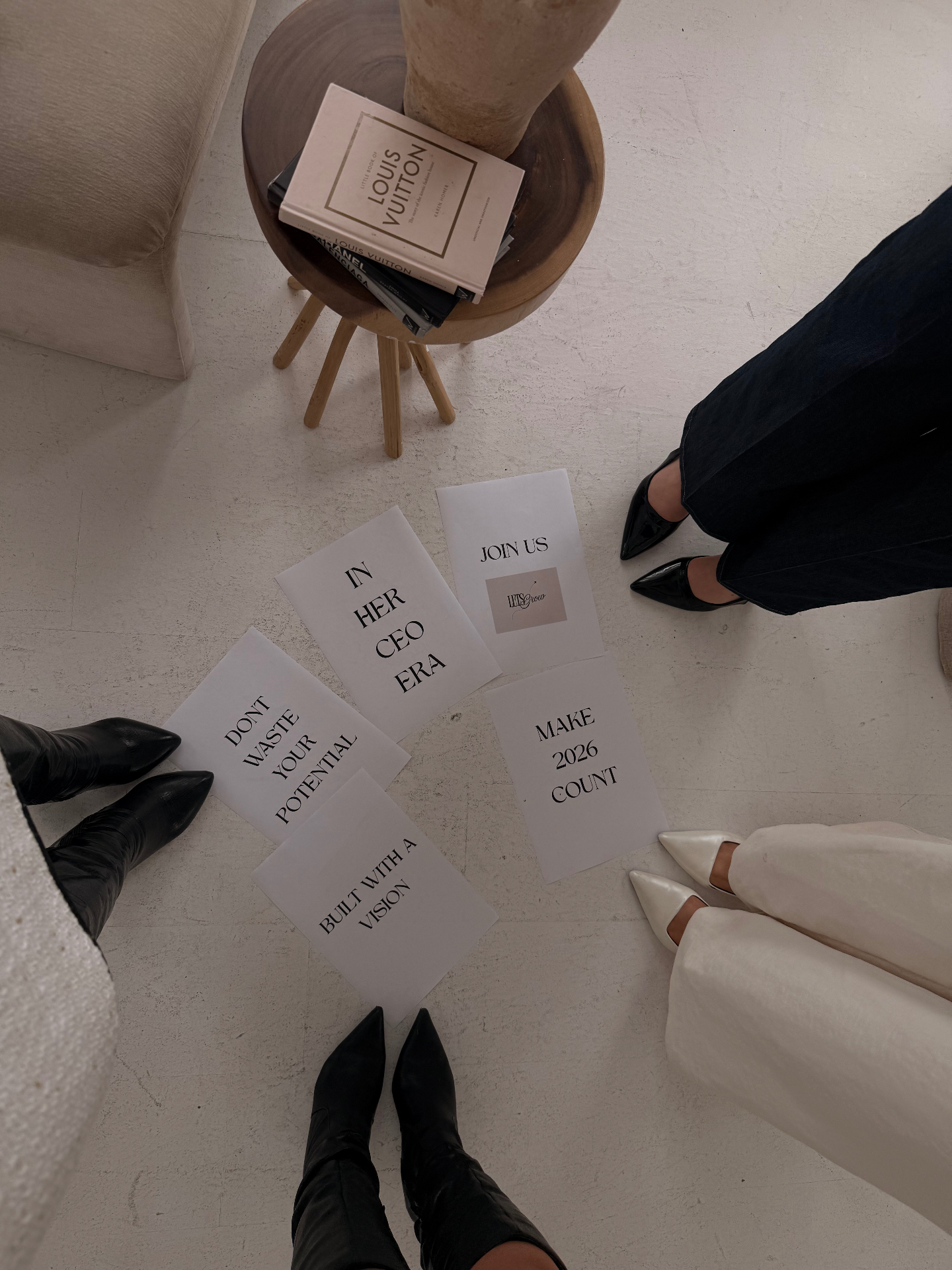 Overhead view of vision affirmation cards fanned out on the studio floor